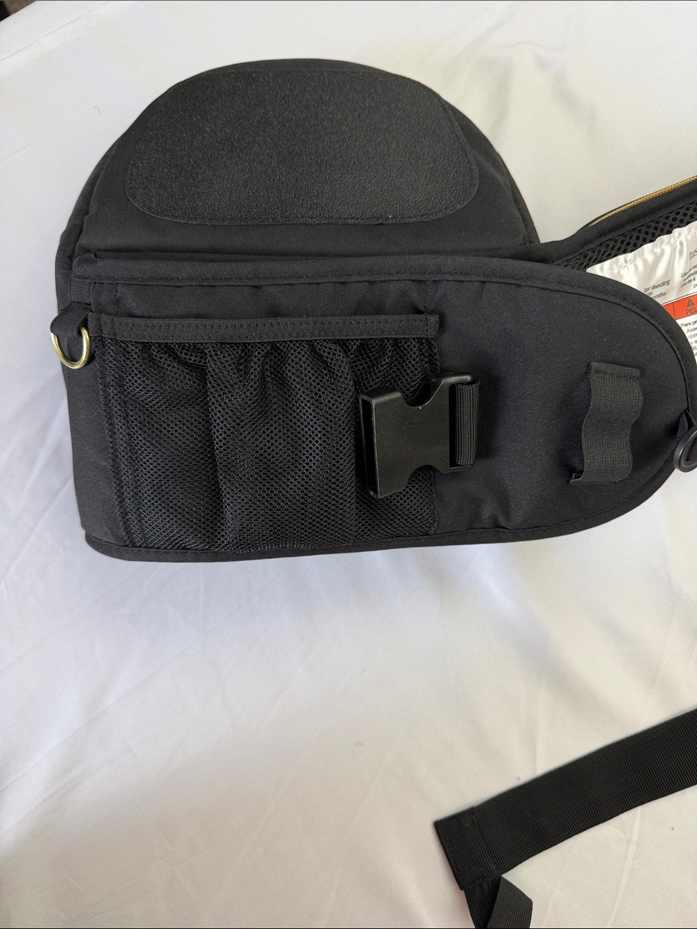 Tushbaby ergonomic hip carrier in black with gold hardware. Adjustable - Picture 4 of 9